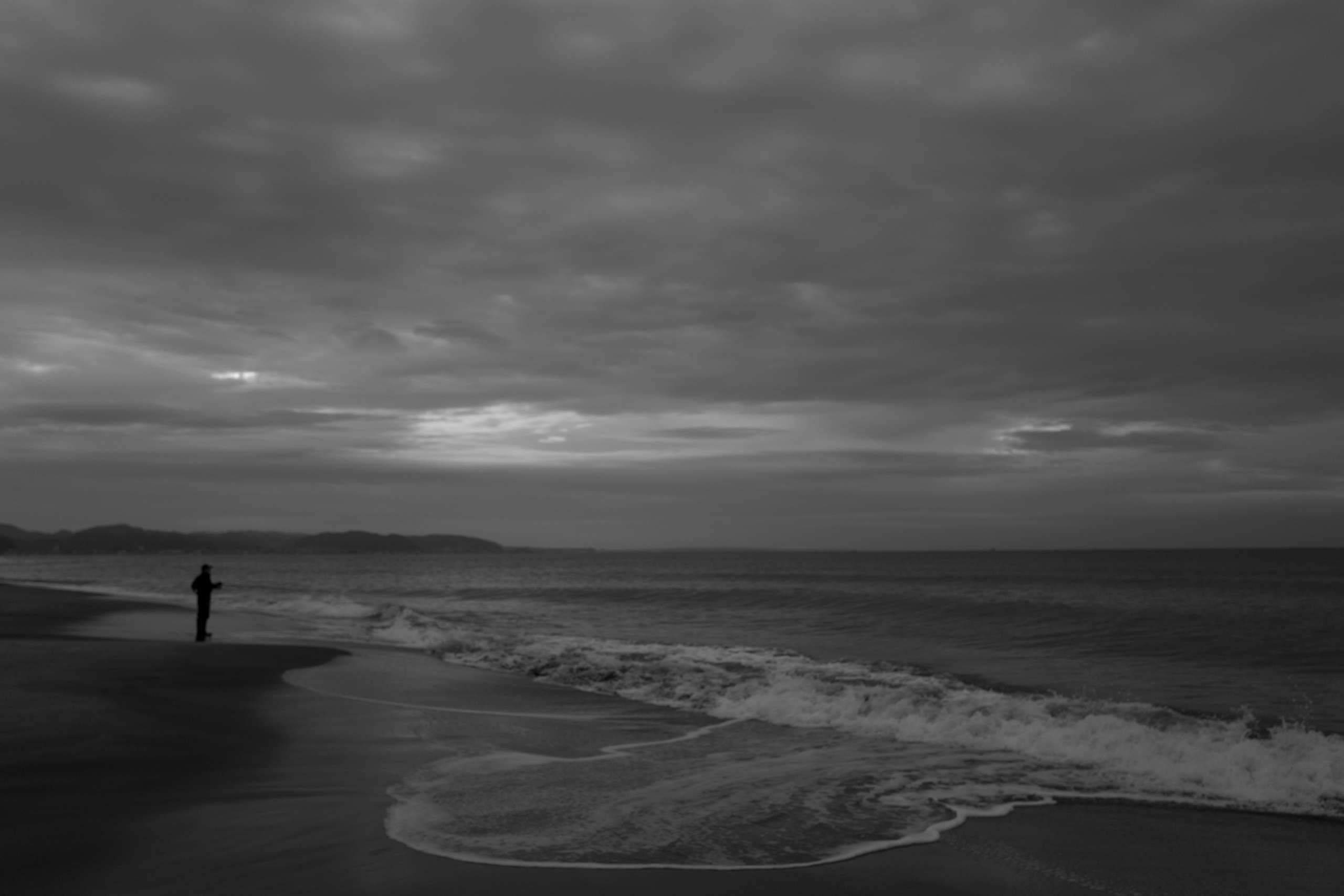 Softly lit window through fog and condensation.