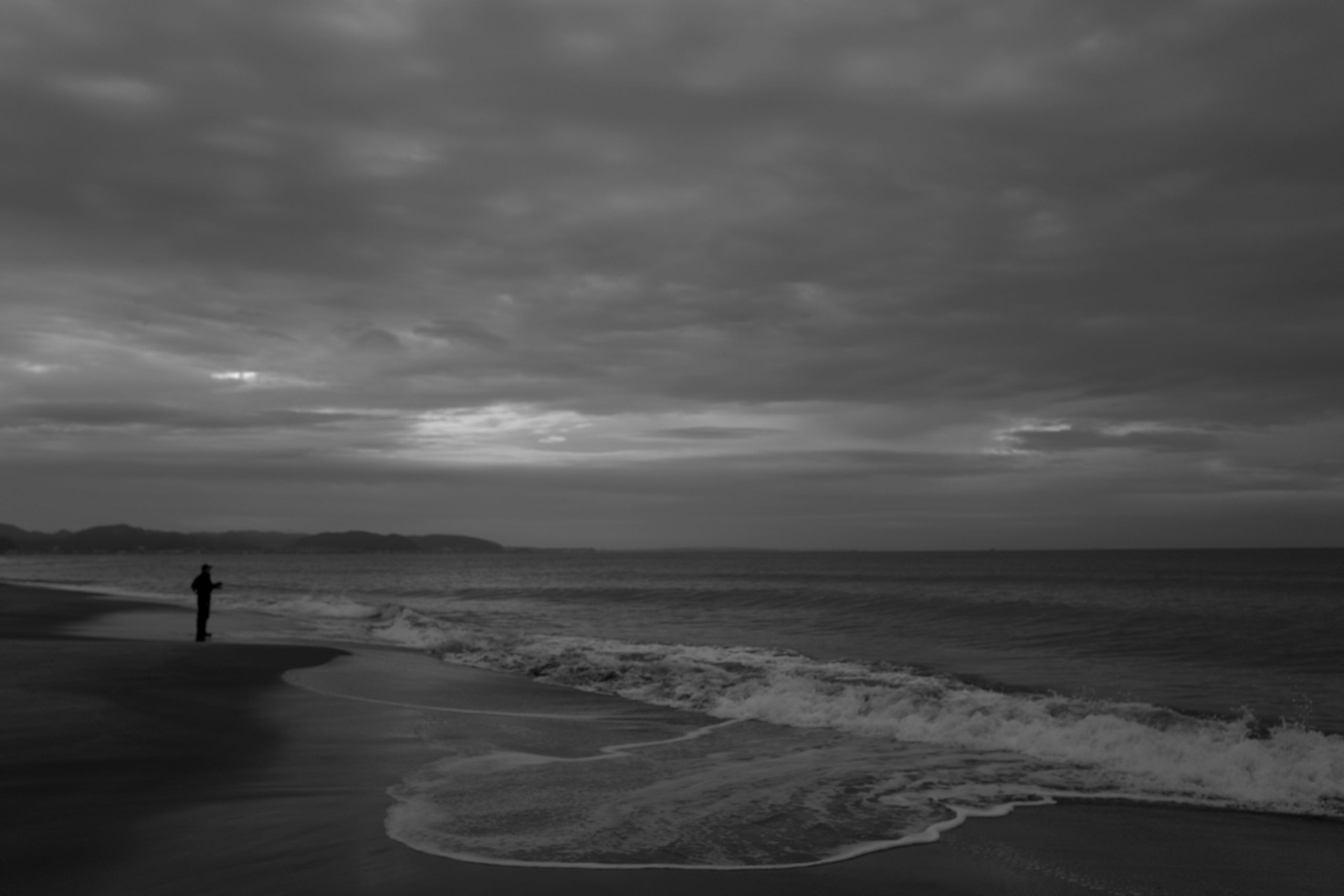 Softly lit window through fog and condensation.